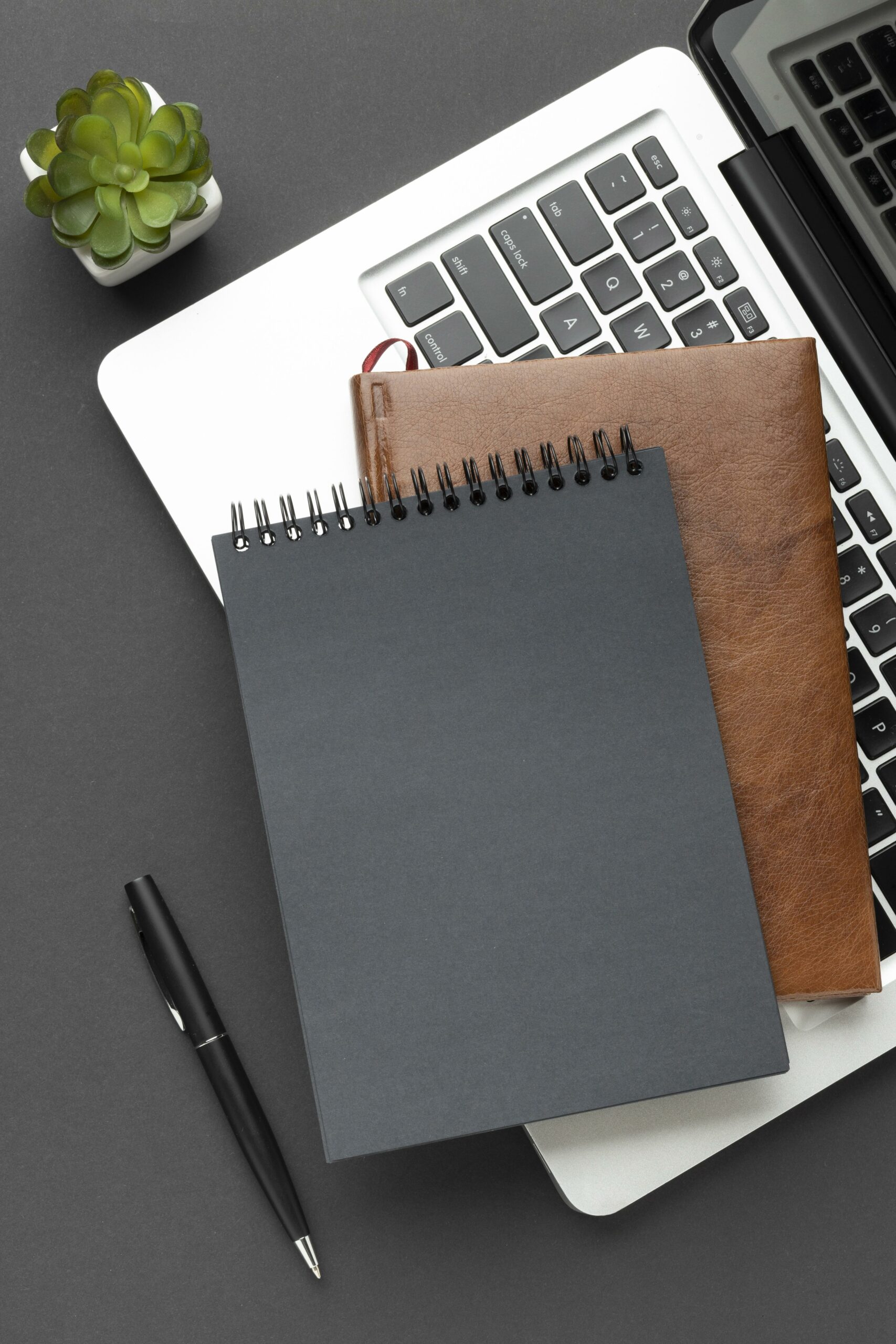 top-view-notepads-laptop-arrangement